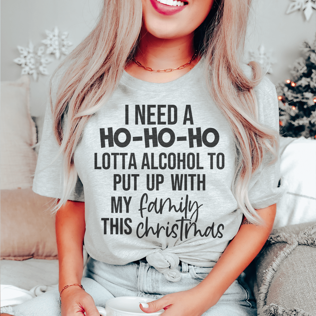 A festive 'I Need A Ho Ho Ho Lotta Alcohol Tee' made from 100% soft cotton, featuring a vibrant holiday-themed design.