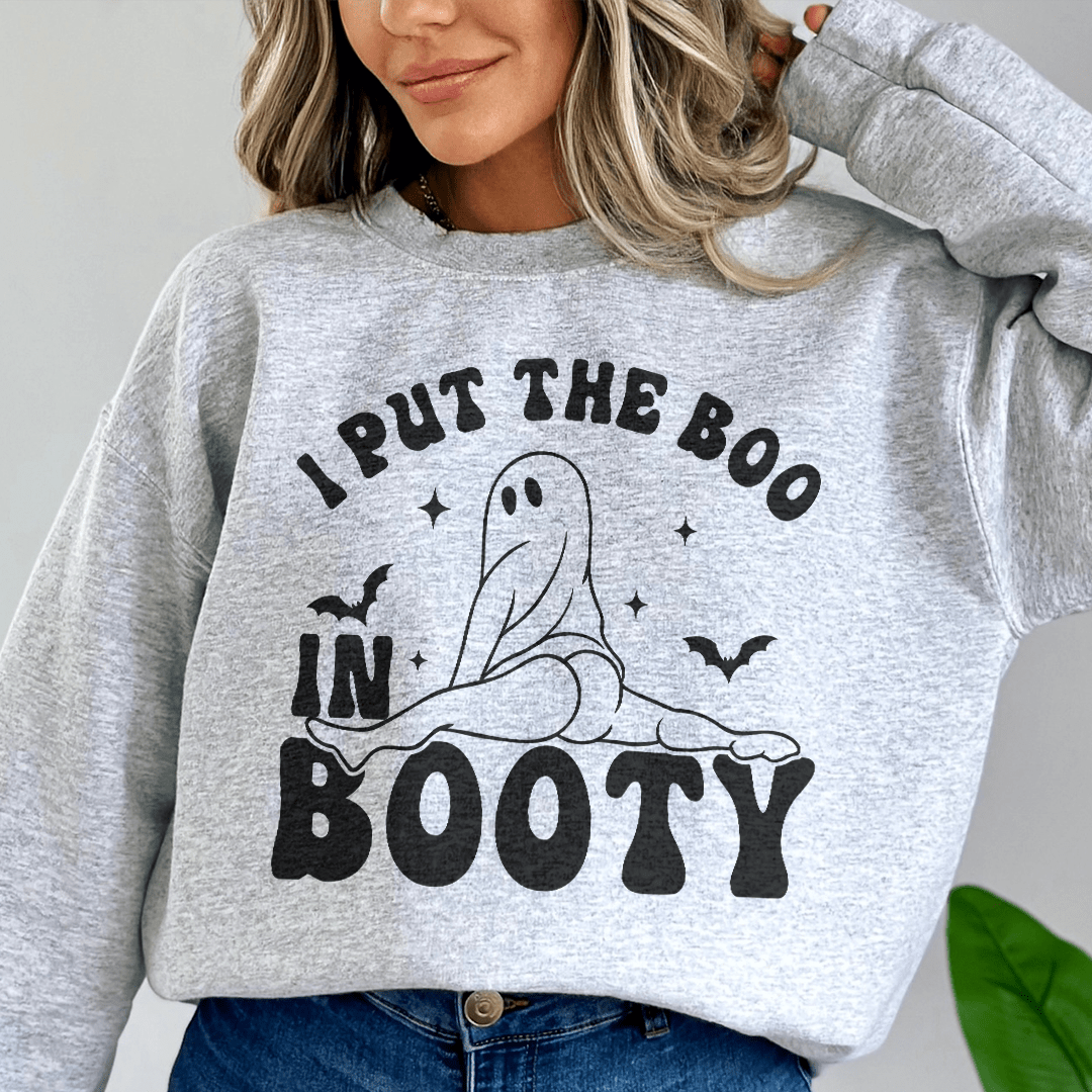 A cozy hoodie featuring the phrase 'I Put The Boo In Booty', designed by top artists, showcasing a unique and stylish look.