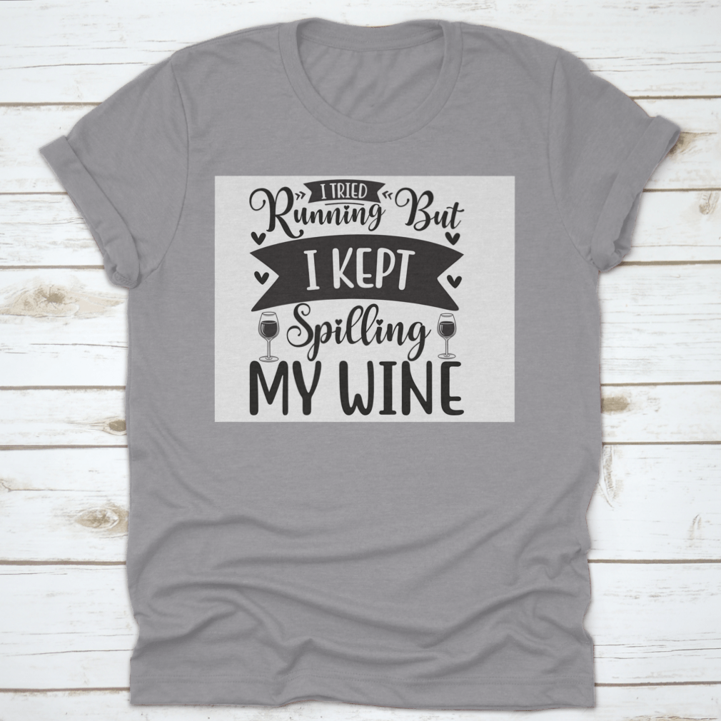 A humorous T-shirt featuring the phrase 'I Tried Running But I Kept Spilling My Wine', showcasing a classic fit and soft fabric.