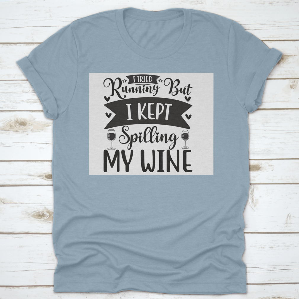 A humorous T-shirt featuring the phrase 'I Tried Running But I Kept Spilling My Wine', showcasing a classic fit and soft fabric.