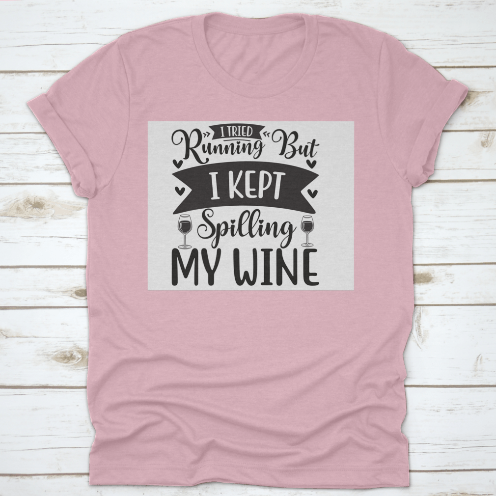 A humorous T-shirt featuring the phrase 'I Tried Running But I Kept Spilling My Wine', showcasing a classic fit and soft fabric.