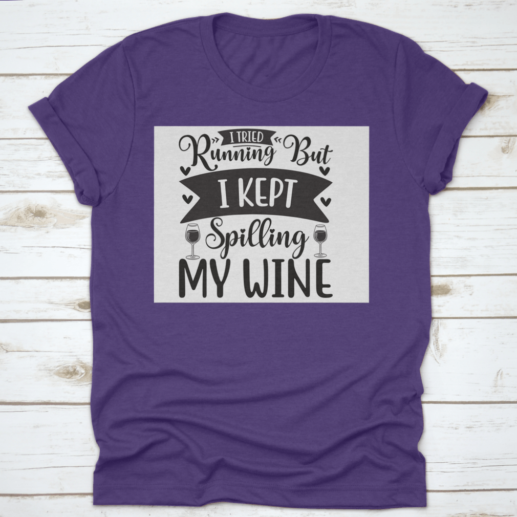 A humorous T-shirt featuring the phrase 'I Tried Running But I Kept Spilling My Wine', showcasing a classic fit and soft fabric.