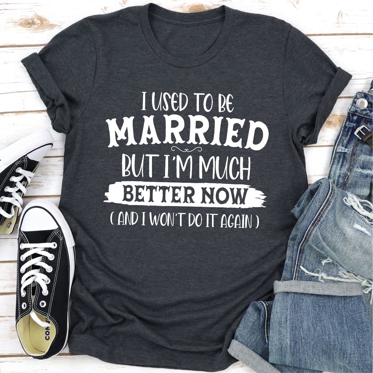 A stylish t-shirt with the phrase 'I Used To Be Married But I'm Much Better Now And I Won't Do It Again' printed on it, showcasing its soft fabric and durable stitching.