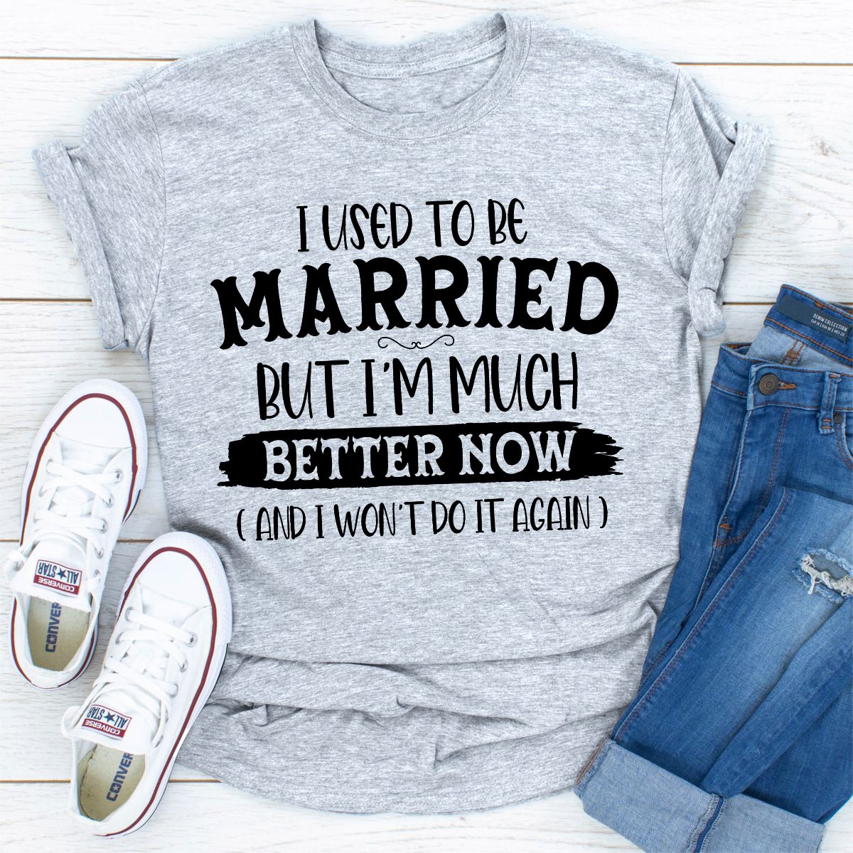 A stylish t-shirt with the phrase 'I Used To Be Married But I'm Much Better Now And I Won't Do It Again' printed on it, showcasing its soft fabric and durable stitching.