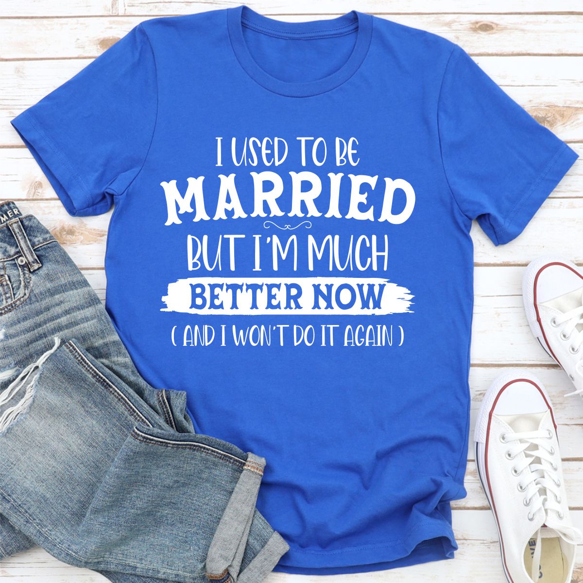 A stylish t-shirt with the phrase 'I Used To Be Married But I'm Much Better Now And I Won't Do It Again' printed on it, showcasing its soft fabric and durable stitching.