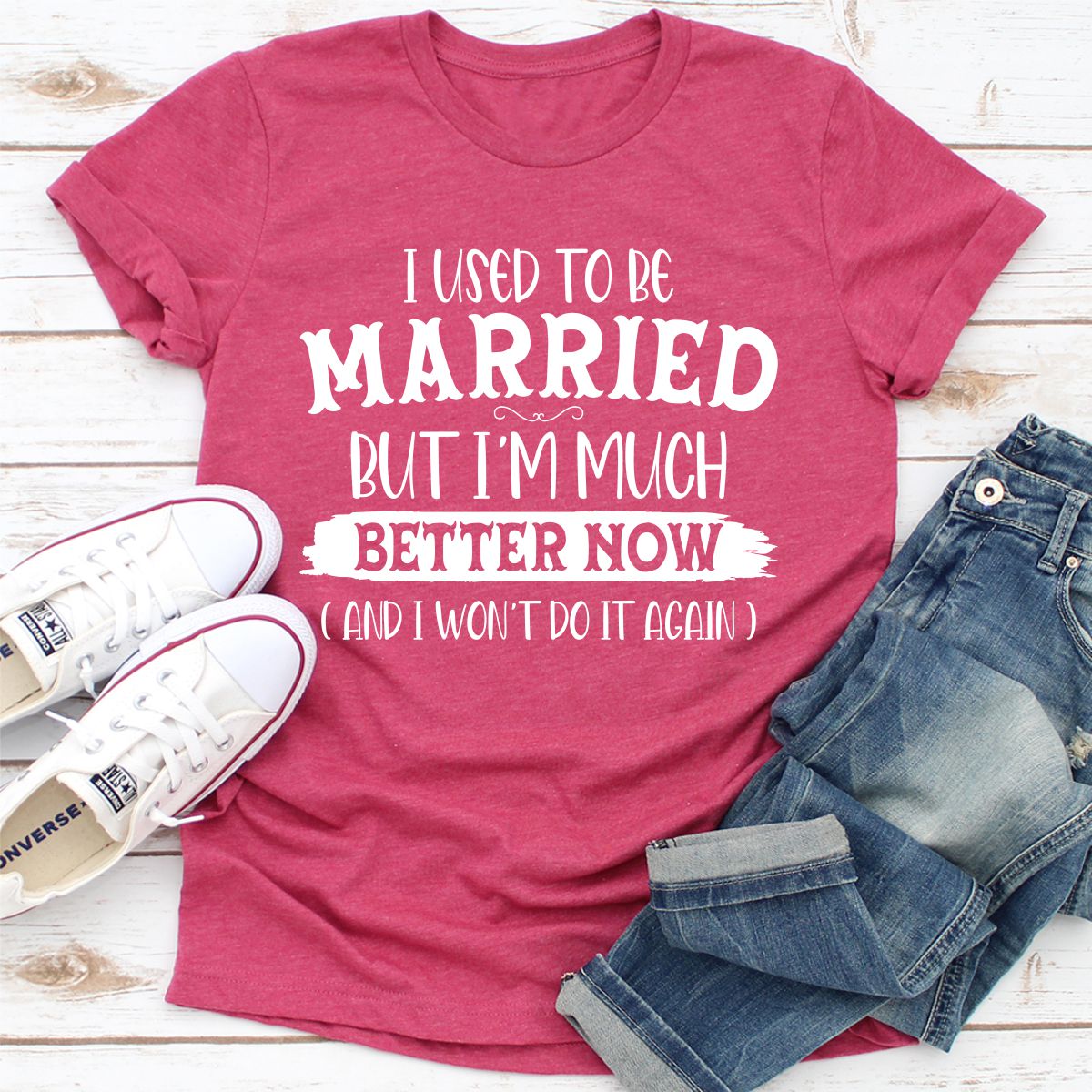 A stylish t-shirt with the phrase 'I Used To Be Married But I'm Much Better Now And I Won't Do It Again' printed on it, showcasing its soft fabric and durable stitching.
