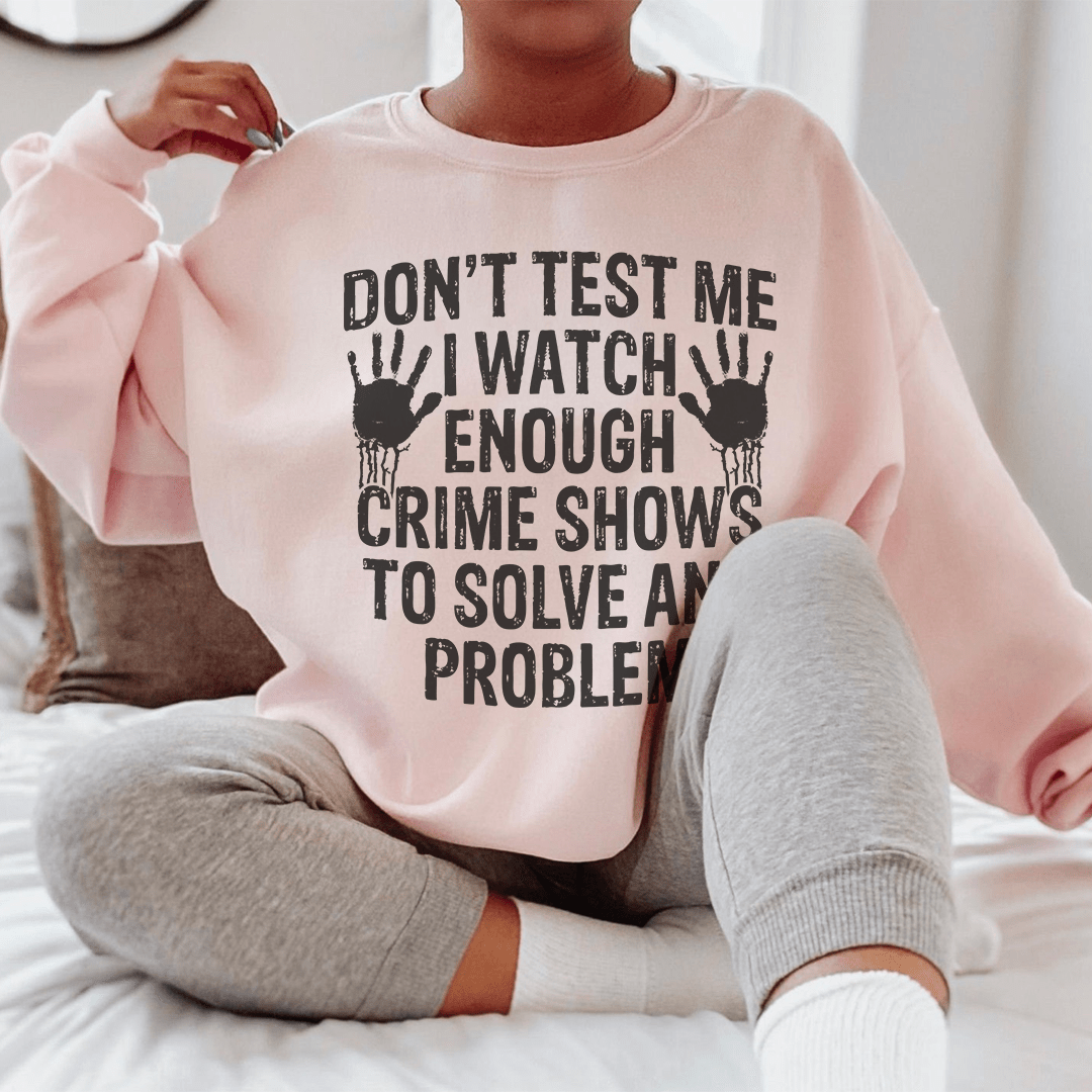 Cozy hoodie featuring the phrase 'I Watch Enough Crime Shows To Solve Any Problem', designed for comfort and style.