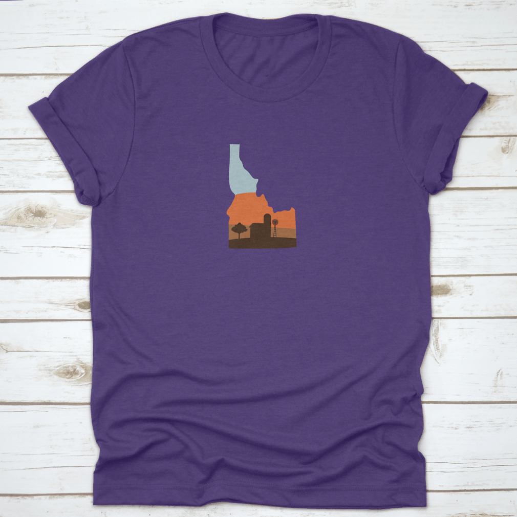 Idaho state shape design featuring a farm at sunset with a windmill and barn, showcasing vibrant colors.