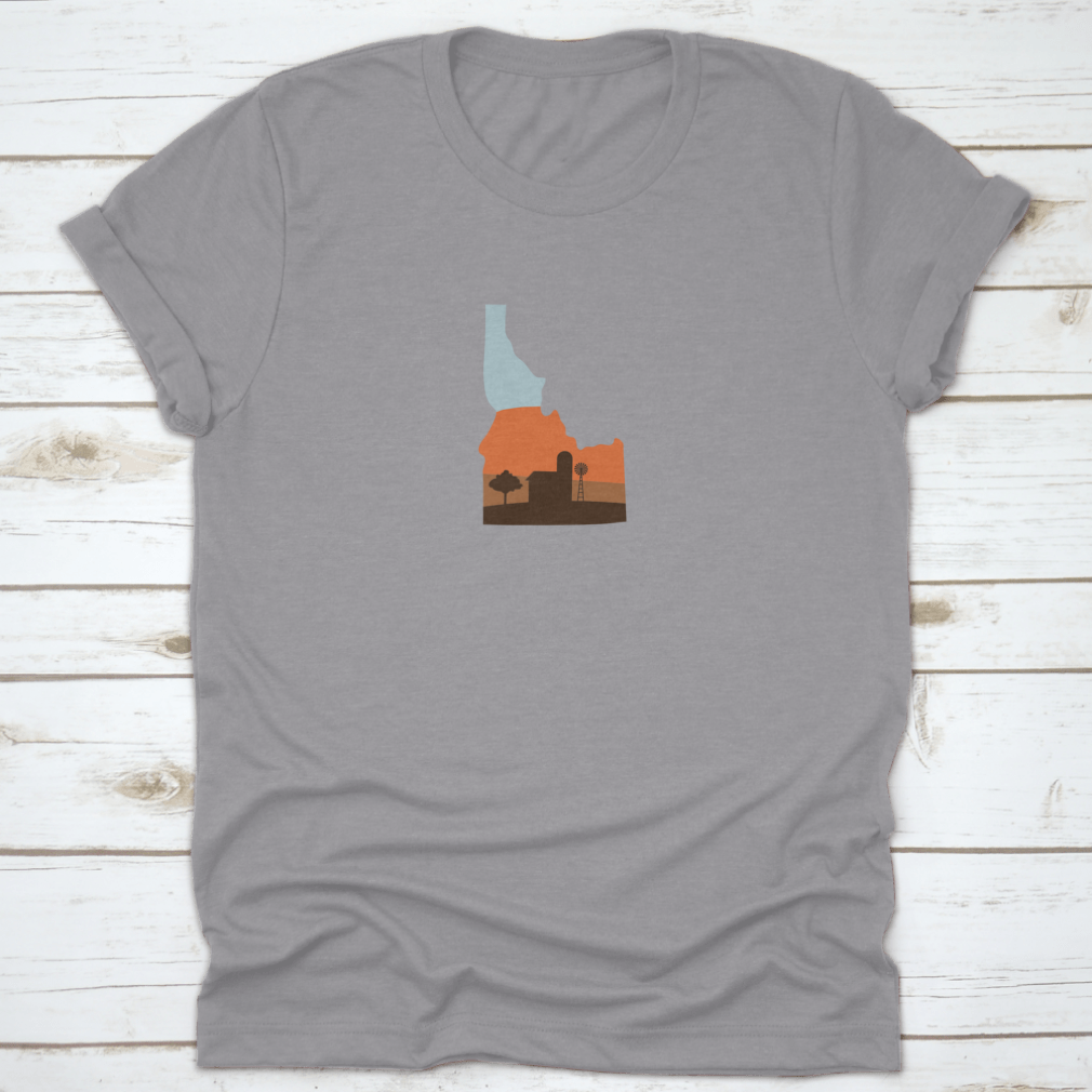 Idaho state shape design featuring a farm at sunset with a windmill and barn, showcasing vibrant colors.