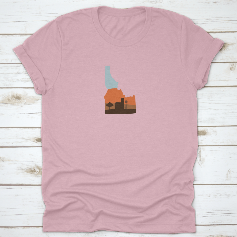 Idaho state shape design featuring a farm at sunset with a windmill and barn, showcasing vibrant colors.