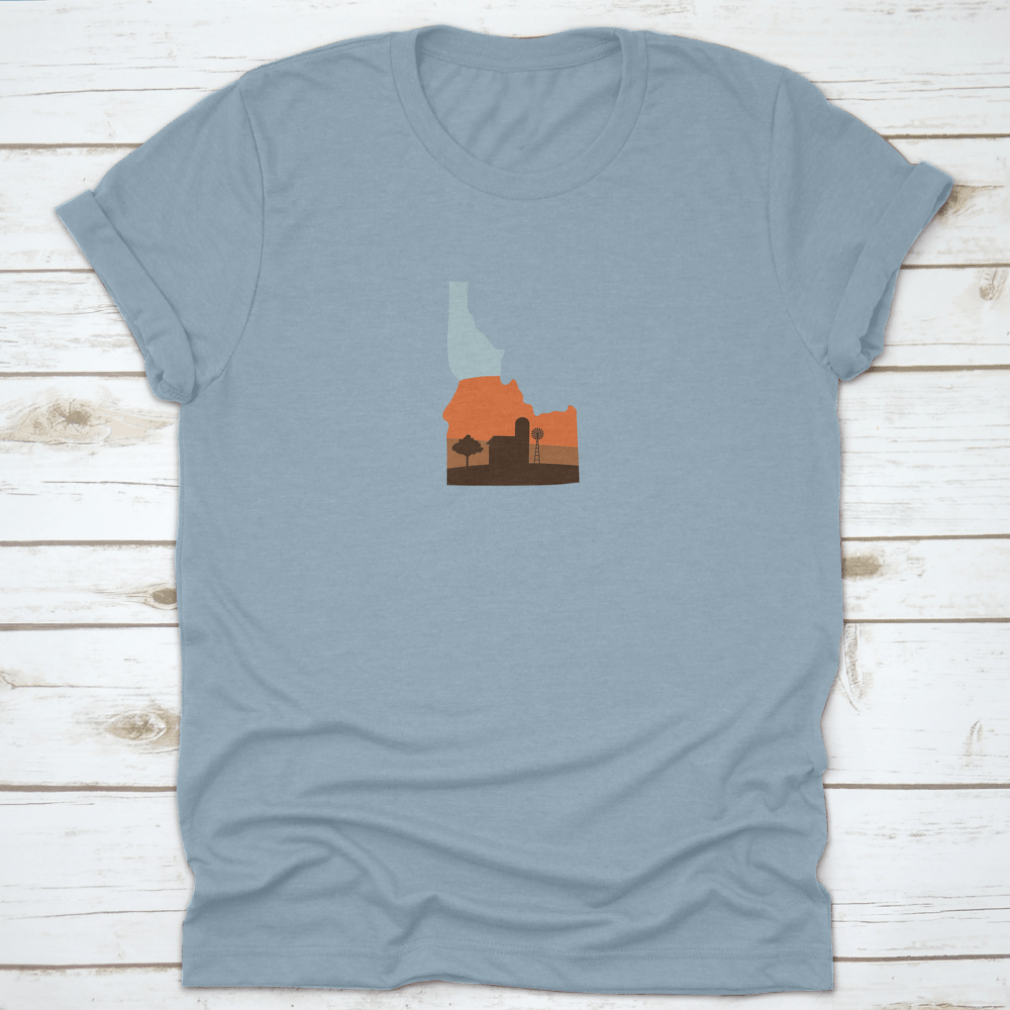 Idaho state shape design featuring a farm at sunset with a windmill and barn, showcasing vibrant colors.