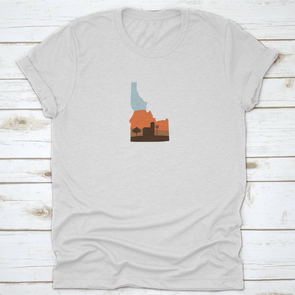 Idaho state shape design featuring a farm at sunset with a windmill and barn, showcasing vibrant colors.