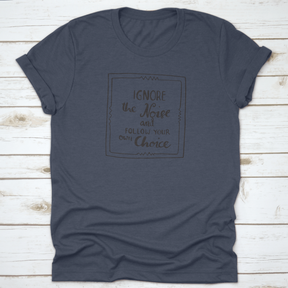 A stylish white t-shirt featuring the phrase 'Ignore The Noise And Follow Your Own Choice' printed boldly, showcasing its comfortable fit and quality fabric.