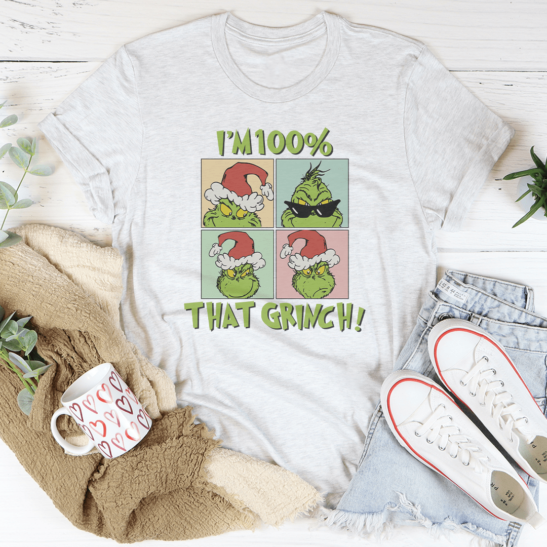 A festive I'm 100% That Grinch Tee made from 100% soft cotton, featuring a playful Grinch design, perfect for holiday celebrations.