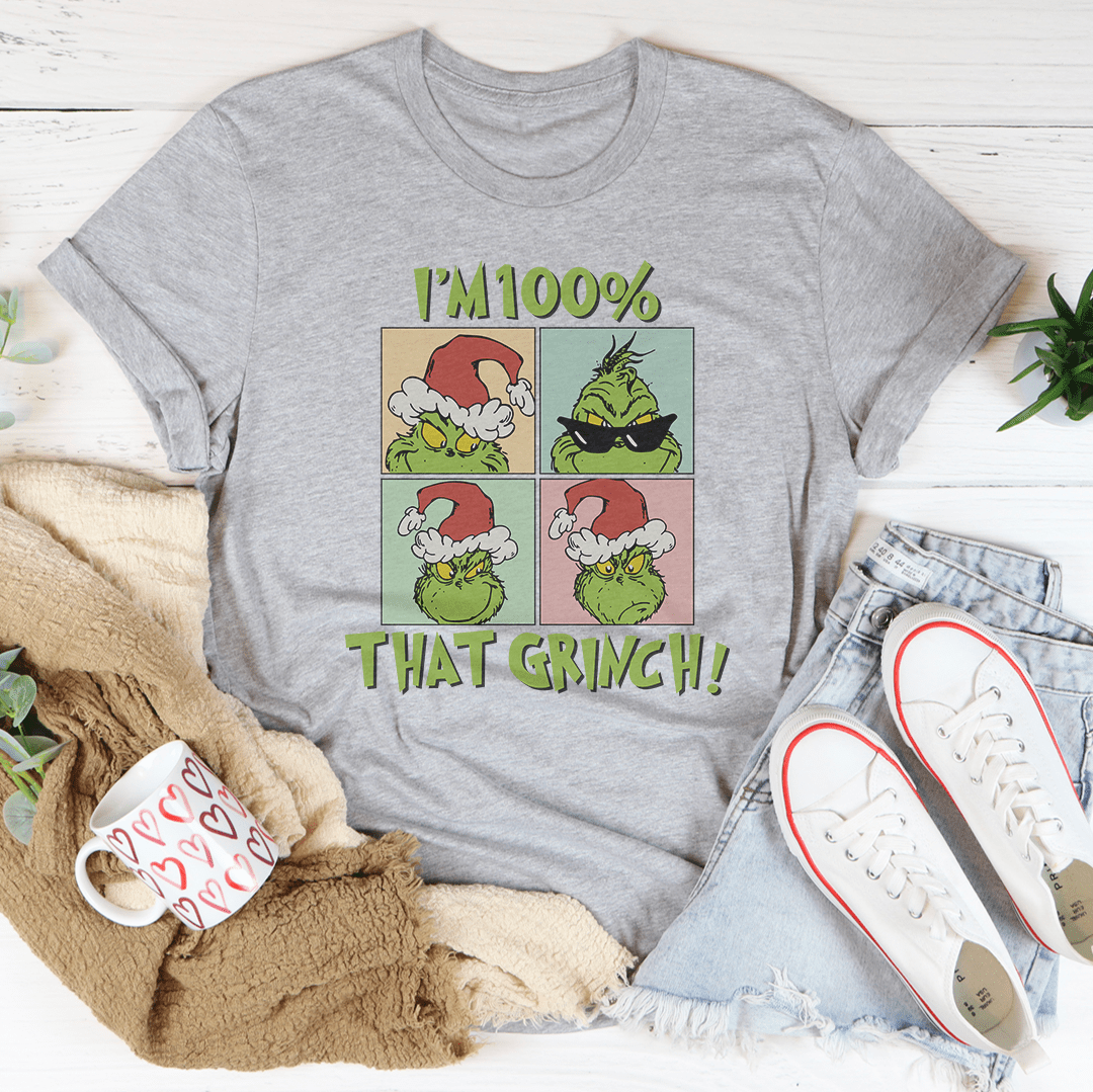 A festive I'm 100% That Grinch Tee made from 100% soft cotton, featuring a playful Grinch design, perfect for holiday celebrations.