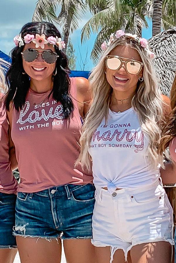 Two stylish muscle tank tops featuring romantic phrases, perfect for bachelorette parties and summer events.