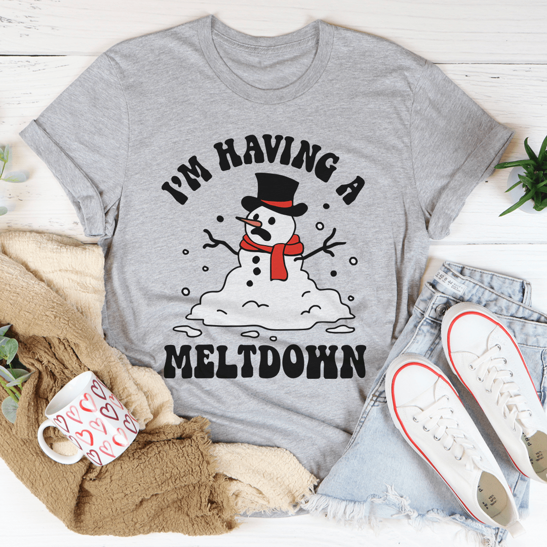 A festive I'm Having A Meltdown Tee featuring a cheerful holiday design, made from 100% soft cotton, perfect for Christmas celebrations.
