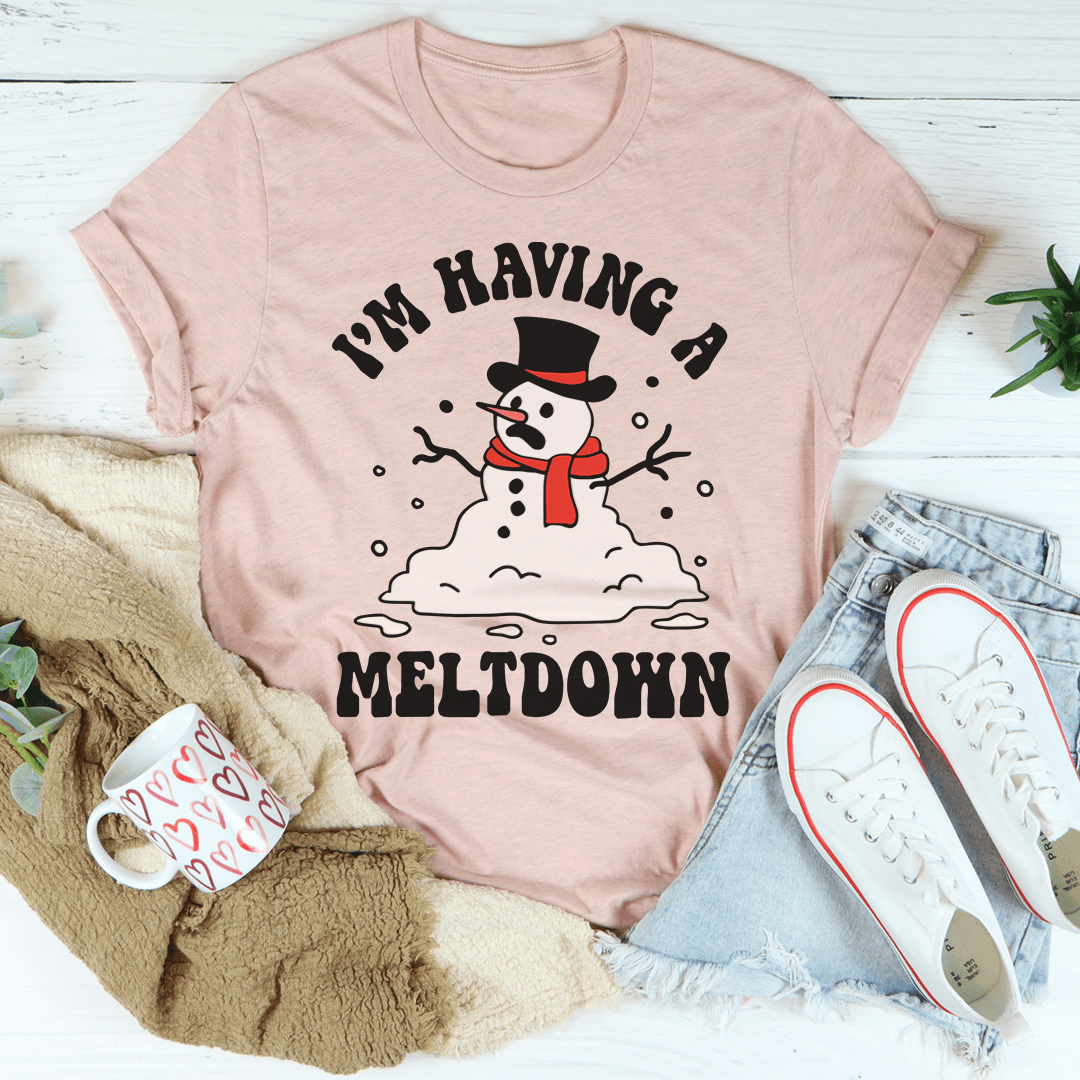 A festive I'm Having A Meltdown Tee featuring a cheerful holiday design, made from 100% soft cotton, perfect for Christmas celebrations.
