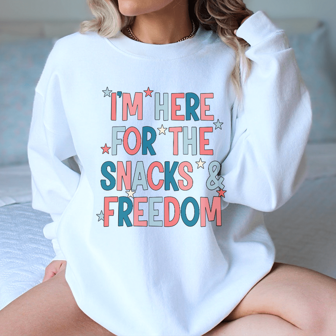 Cozy sweats featuring unique designs celebrating snacks and freedom, made from cotton/poly fleece blend.