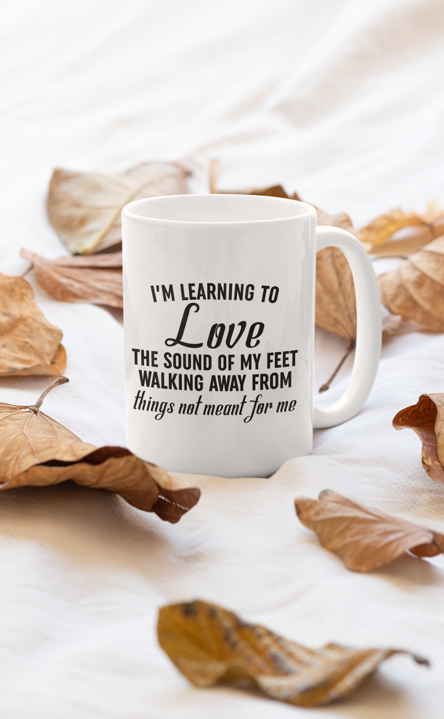 A stylish 11oz ceramic mug with a glossy Orca coating and a sturdy handle, featuring the phrase 'I'm Learning To Love'.