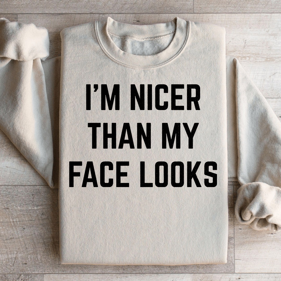 A cozy pair of 'I'm Nicer Than My Face Looks' sweats featuring unique artistic designs, made from soft cotton/poly fleece blend.
