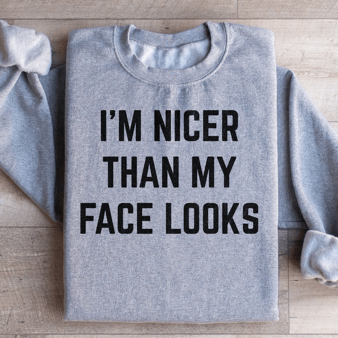 A cozy pair of 'I'm Nicer Than My Face Looks' sweats featuring unique artistic designs, made from soft cotton/poly fleece blend.
