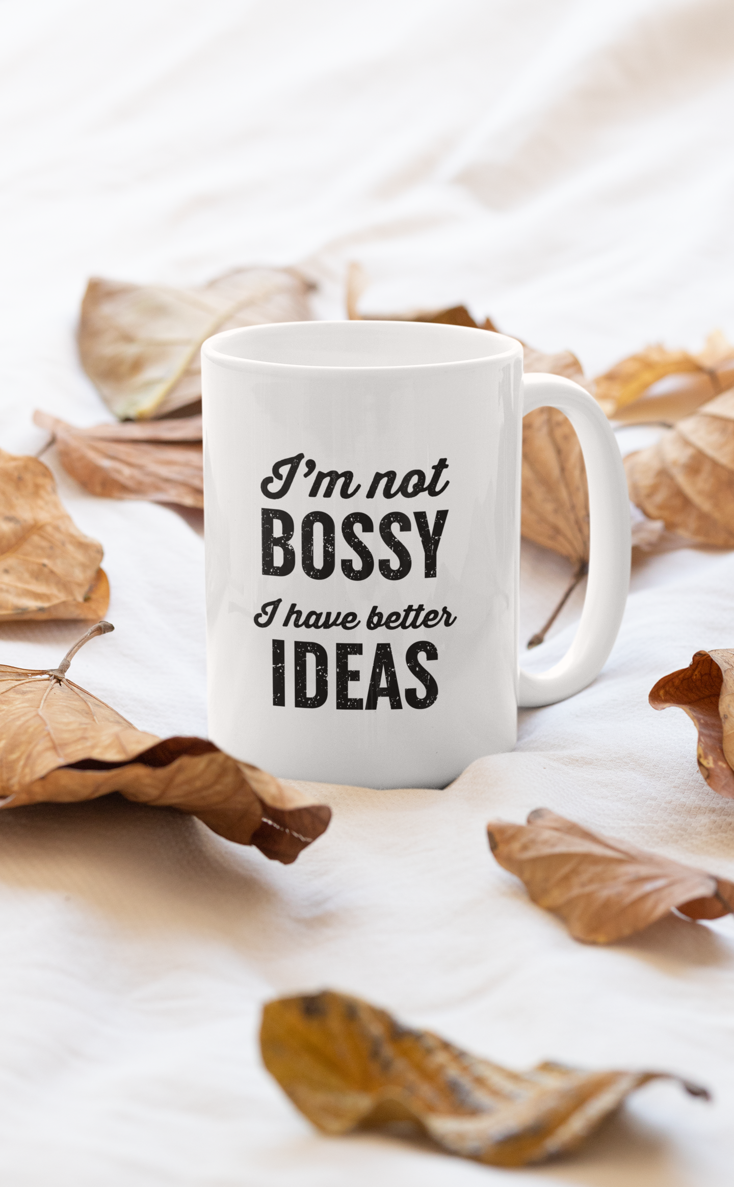 A stylish 11oz ceramic mug with the phrase 'I'm Not Bossy' printed on it, featuring a glossy finish and sturdy handle.