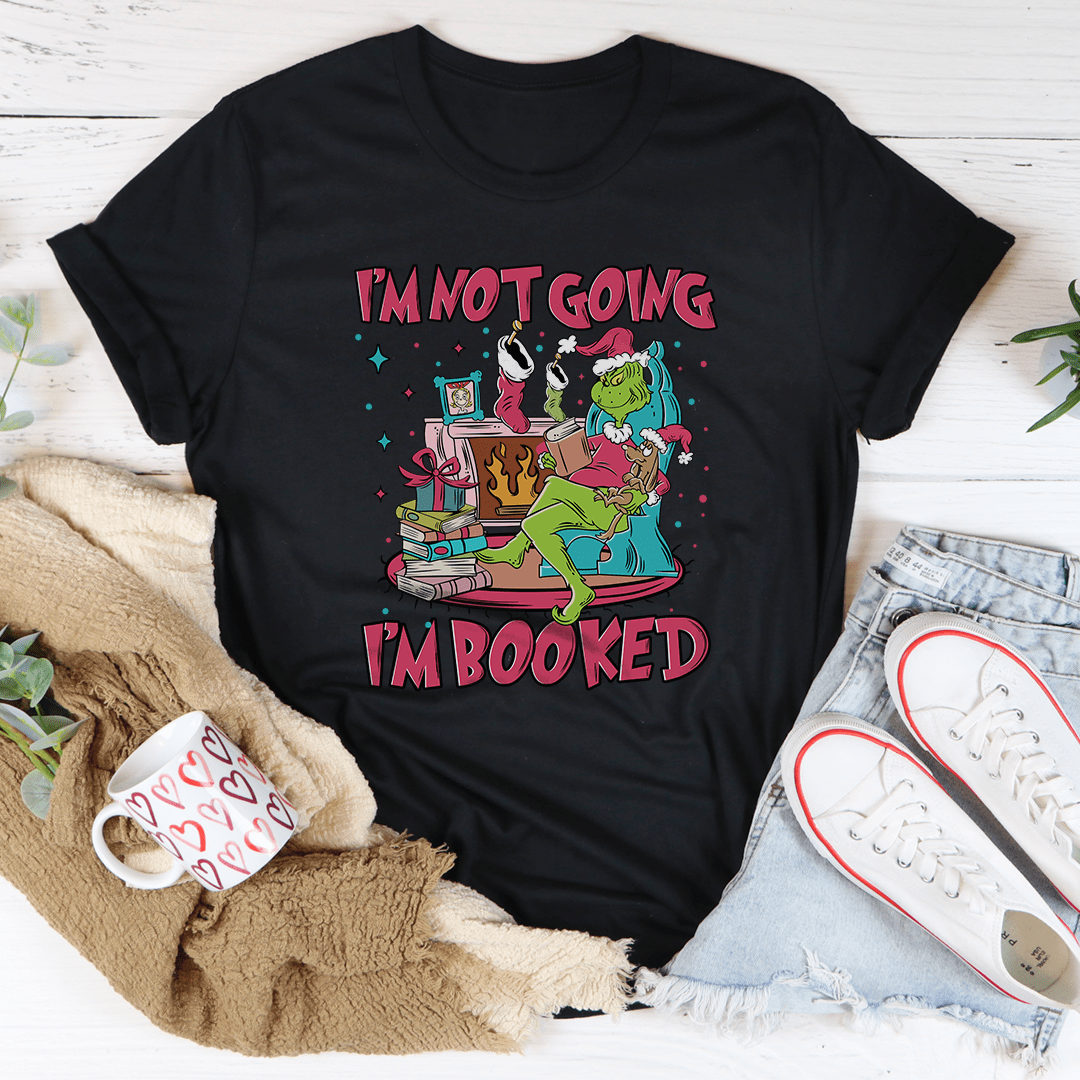 A festive I'm Not Going I'm Booked Tee featuring a playful holiday design, made from 100% soft cotton, perfect for Christmas celebrations.