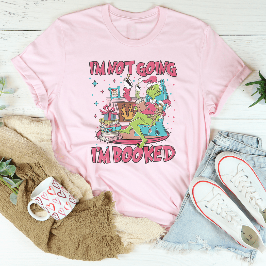 A festive I'm Not Going I'm Booked Tee featuring a playful holiday design, made from 100% soft cotton, perfect for Christmas celebrations.
