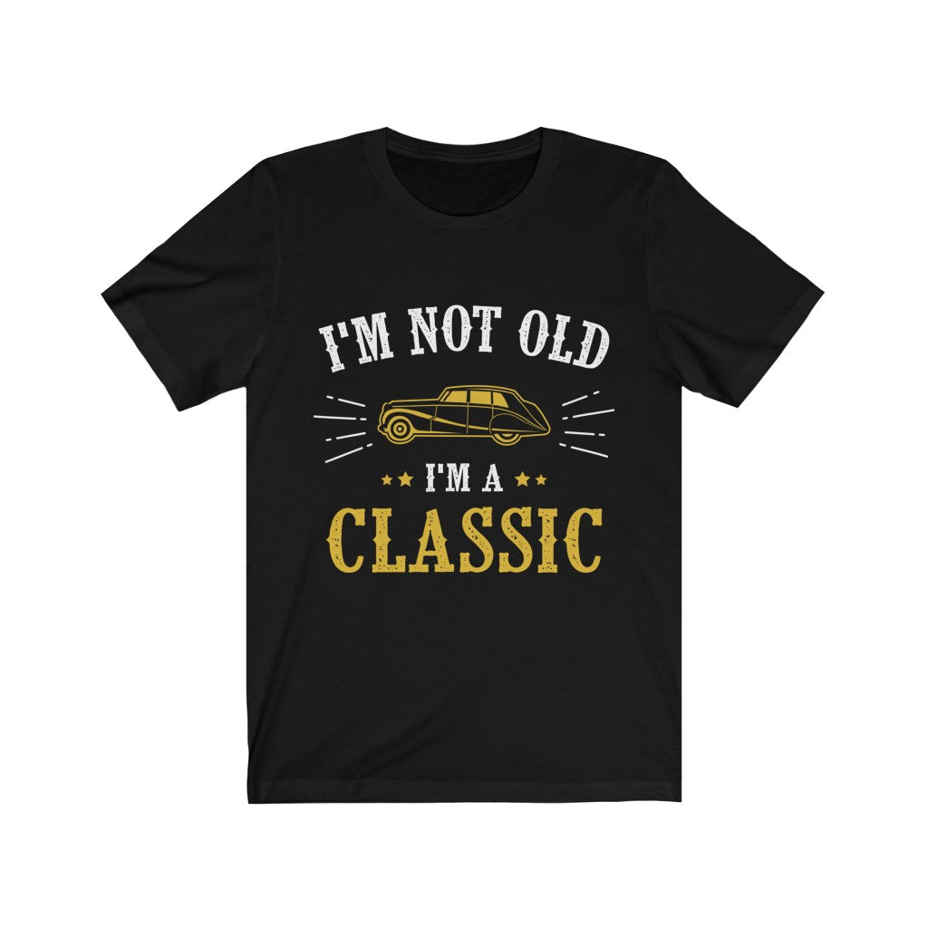 A soft cotton unisex t-shirt featuring the slogan 'I'm Not Old I'm a Classic' in vibrant vinyl print, designed for comfort and style.