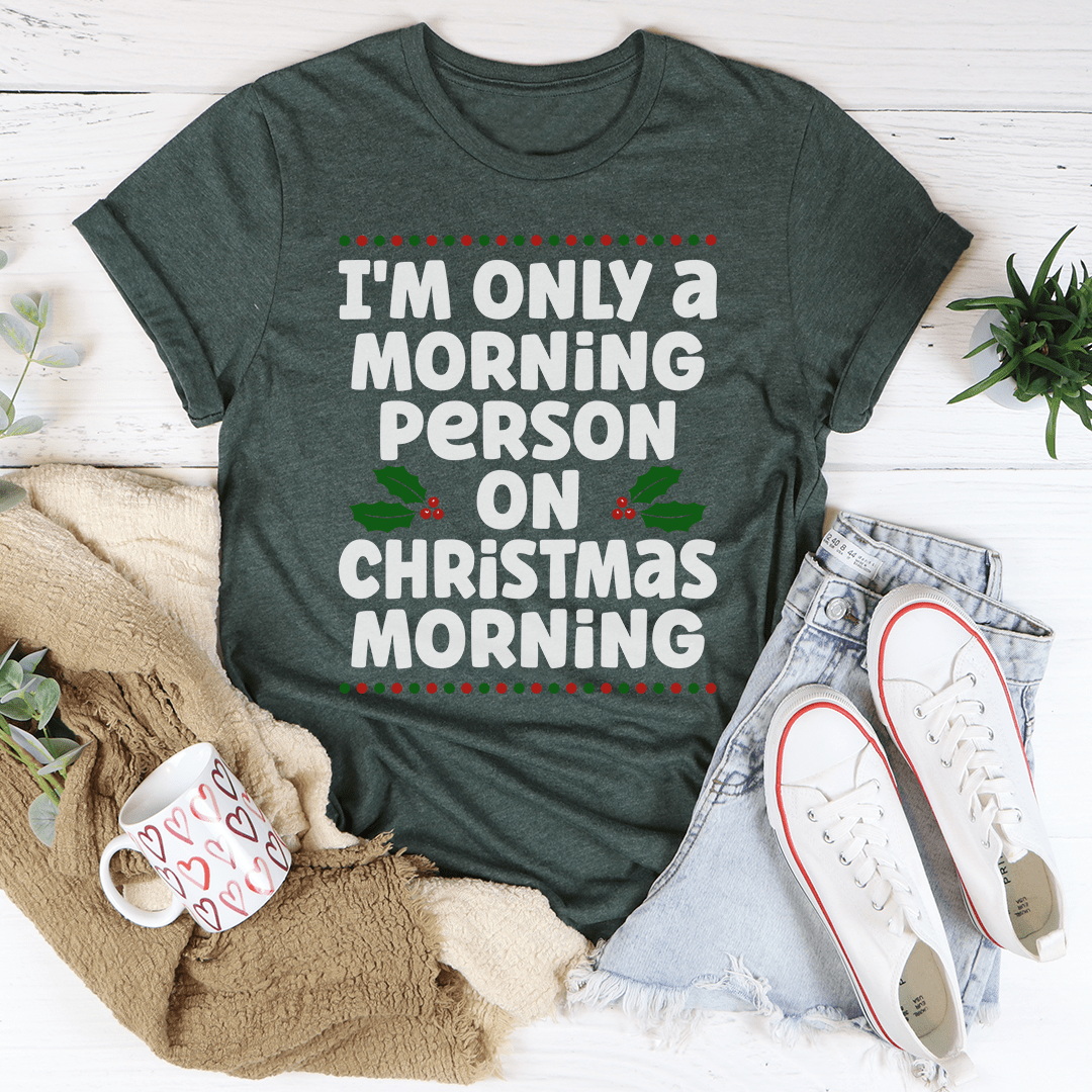 A festive Christmas tee featuring the phrase 'I'm Only A Morning Person On Christmas Morning', made from 100% soft cotton, showcasing vibrant colors.