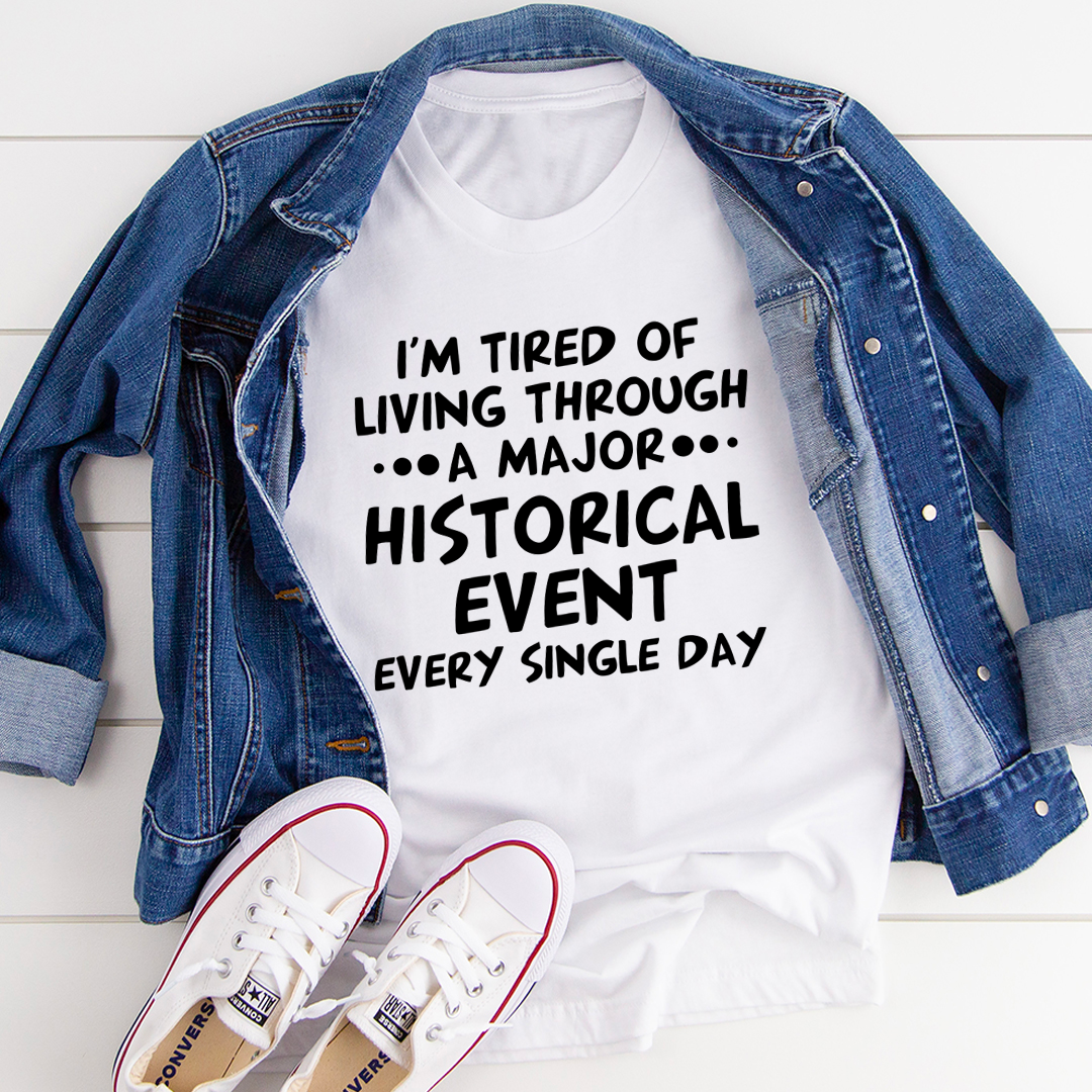 A comfortable and stylish t-shirt featuring the phrase 'I'm Tired Of Living Through A Major Historical Event' printed on it, made from soft cotton.