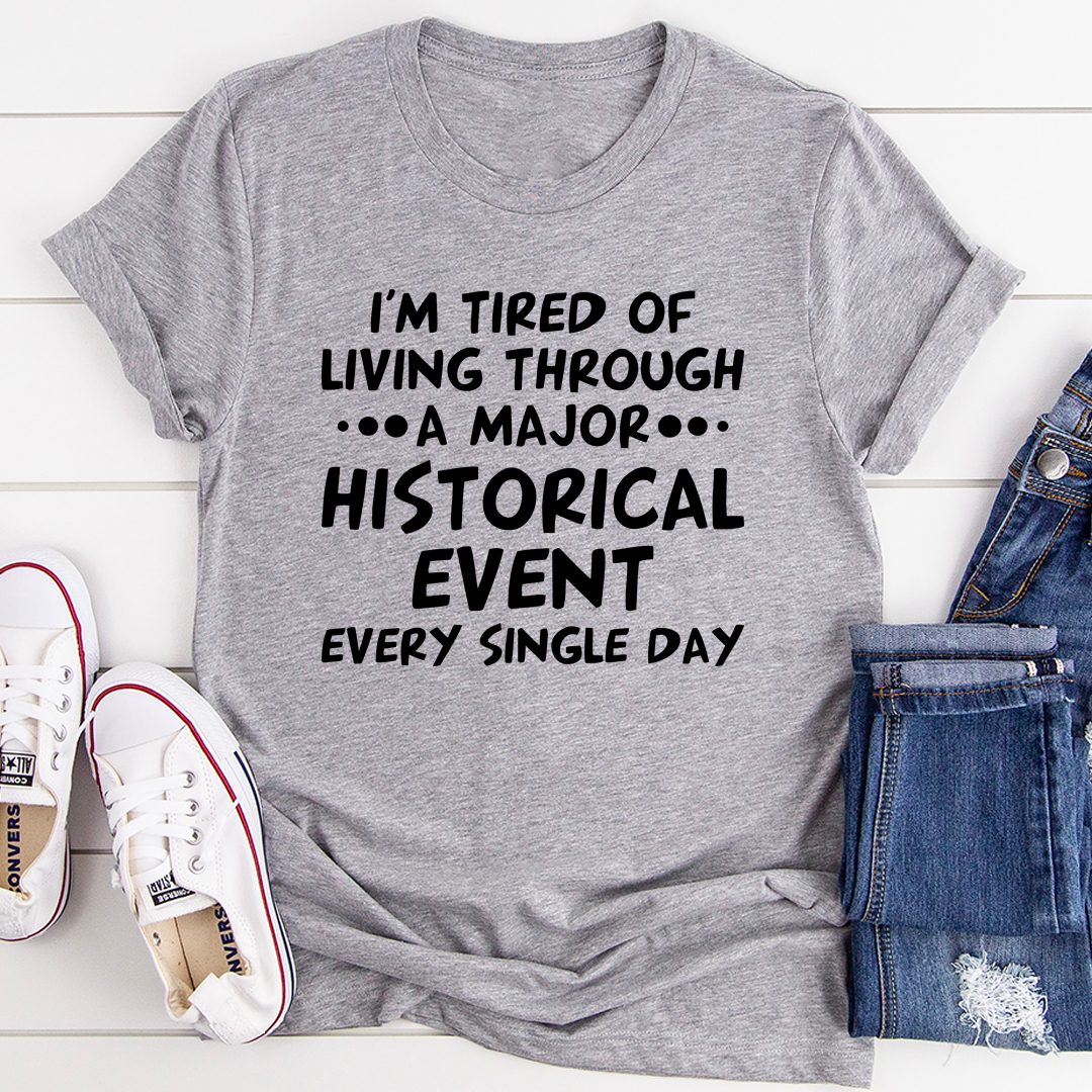 A comfortable and stylish t-shirt featuring the phrase 'I'm Tired Of Living Through A Major Historical Event' printed on it, made from soft cotton.
