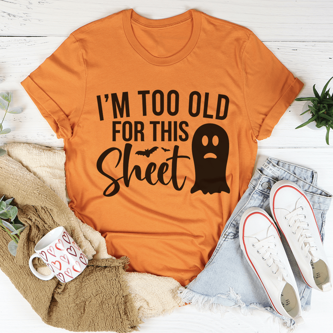 I'm Too Old For This Sheet Tee featuring a humorous Halloween design on a soft cotton fabric.