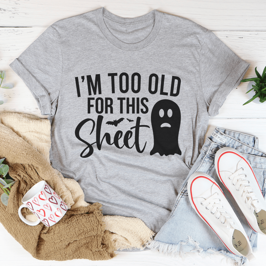 I'm Too Old For This Sheet Tee featuring a humorous Halloween design on a soft cotton fabric.