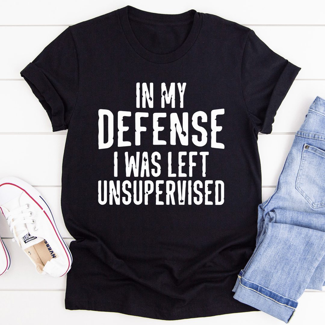 A humorous t-shirt featuring the phrase 'In My Defense I Was Left Unsupervised', made from soft cotton with double stitching.