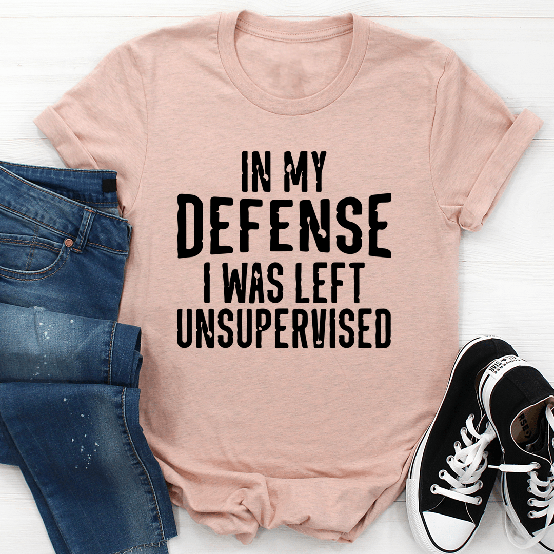 A humorous t-shirt featuring the phrase 'In My Defense I Was Left Unsupervised', made from soft cotton with double stitching.