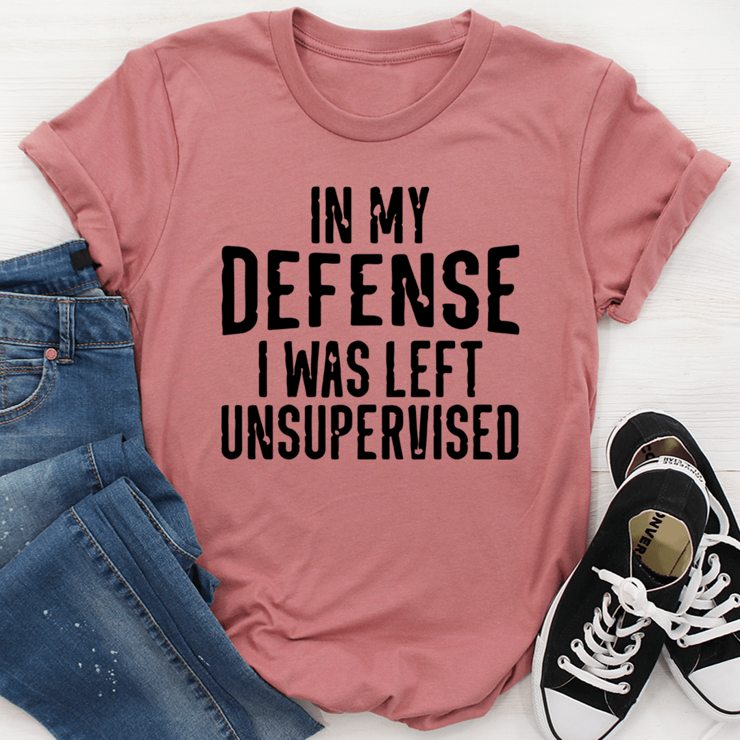 A humorous t-shirt featuring the phrase 'In My Defense I Was Left Unsupervised', made from soft cotton with double stitching.