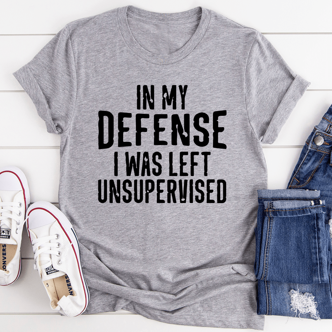 A humorous t-shirt featuring the phrase 'In My Defense I Was Left Unsupervised', made from soft cotton with double stitching.