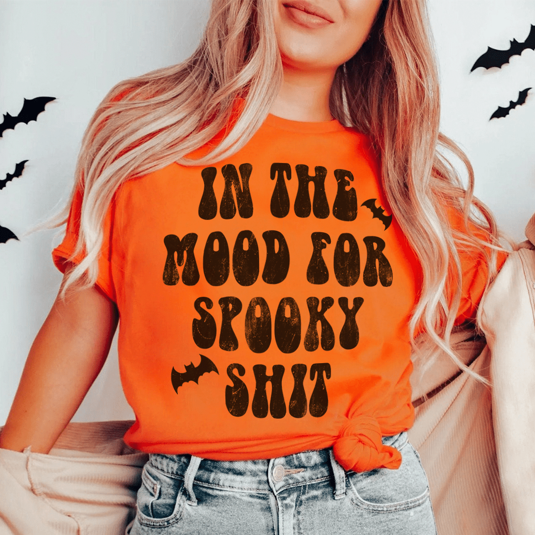 In The Mood Halloween Tee featuring a vibrant Halloween design on soft cotton fabric, perfect for festive celebrations.