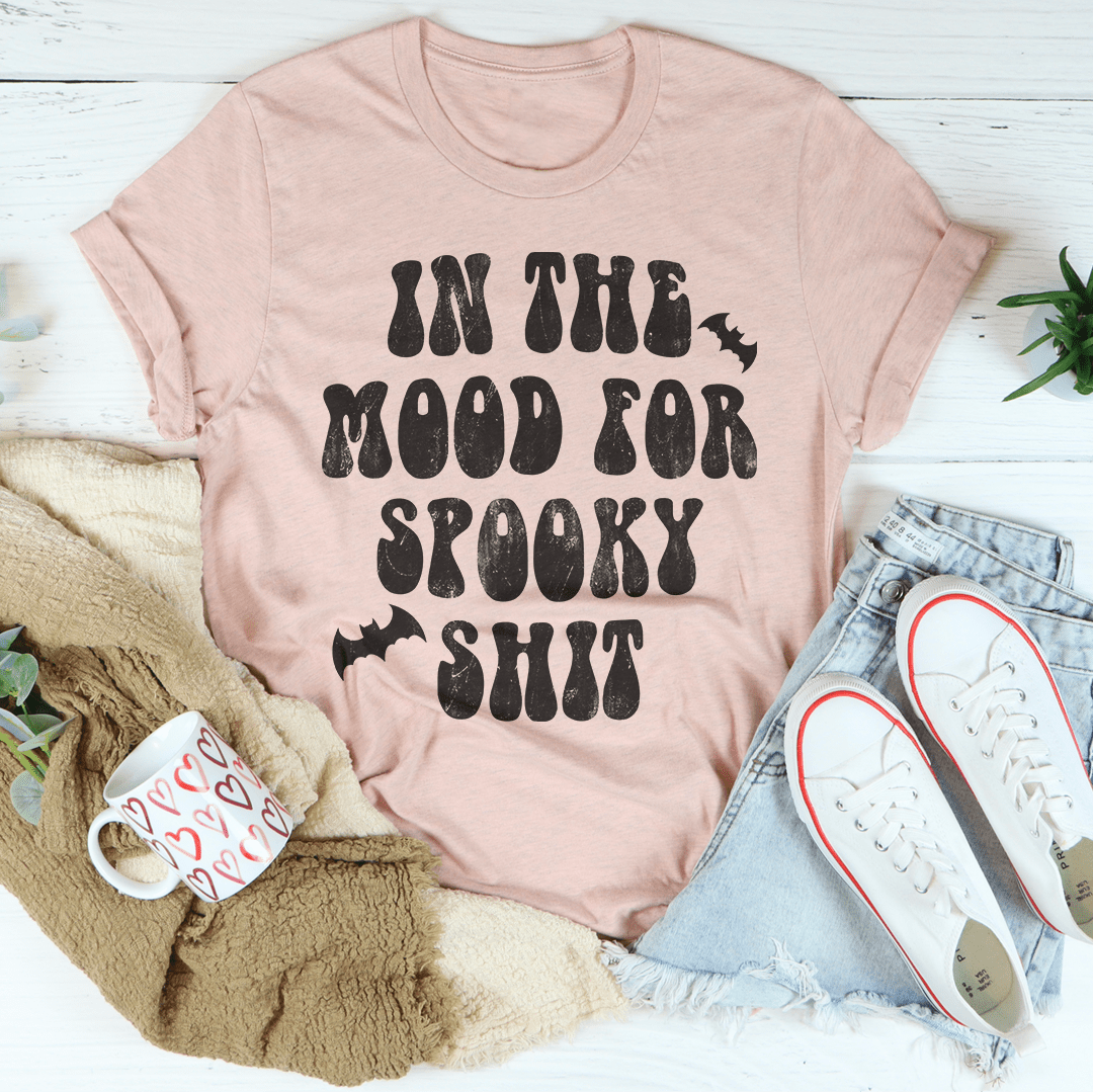 In The Mood Halloween Tee featuring a vibrant Halloween design on soft cotton fabric, perfect for festive celebrations.