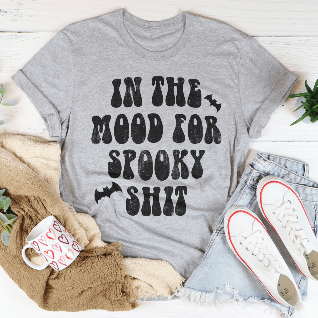 In The Mood Halloween Tee featuring a vibrant Halloween design on soft cotton fabric, perfect for festive celebrations.