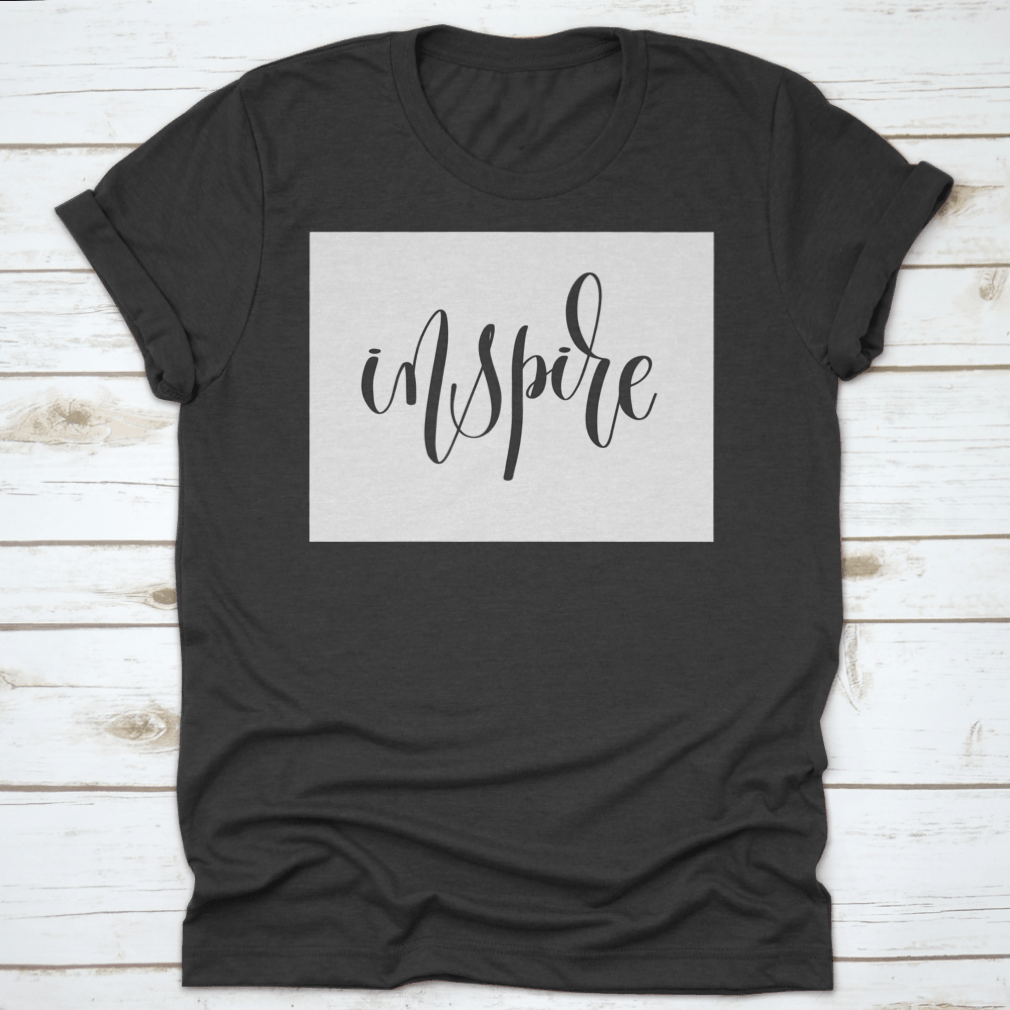 A stylish black t-shirt featuring an inspiring motivational quote in bold black ink, made from 100% cotton for comfort.