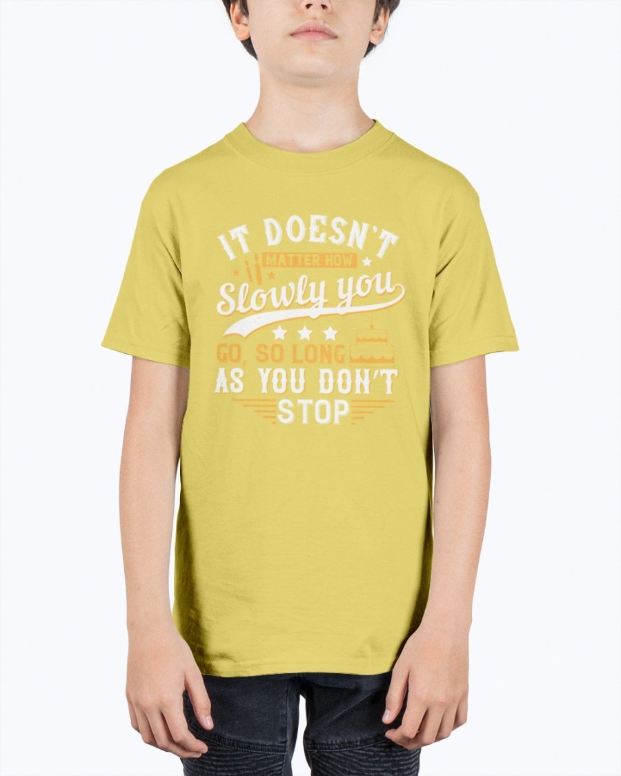 A motivational youth t-shirt featuring the quote 'It doesn’t matter how slowly you go, so long as you don’t stop' in a stylish design.