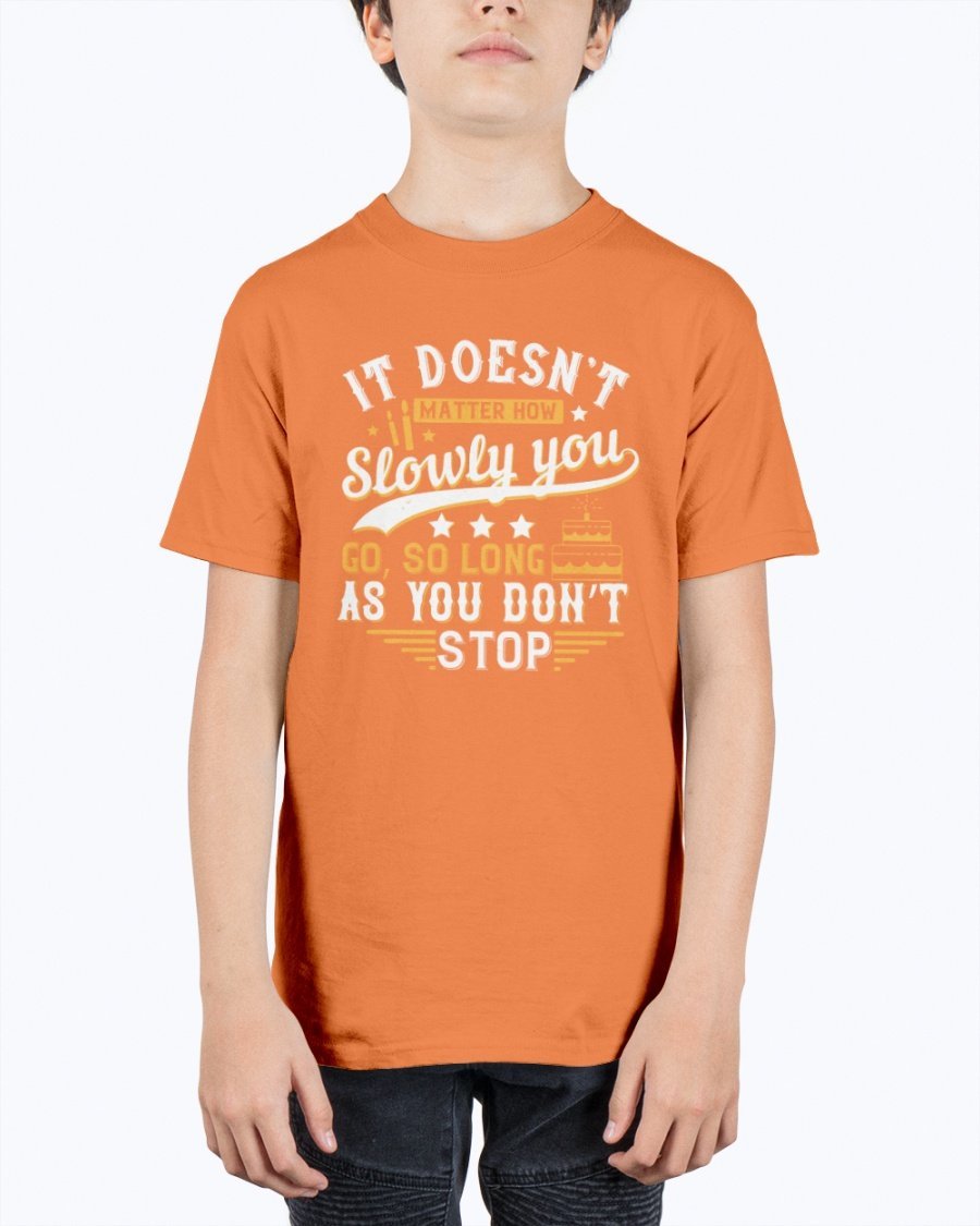 A motivational youth t-shirt featuring the quote 'It doesn’t matter how slowly you go, so long as you don’t stop' in a stylish design.