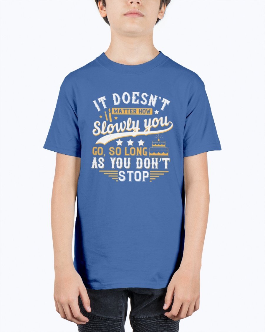 A motivational youth t-shirt featuring the quote 'It doesn’t matter how slowly you go, so long as you don’t stop' in a stylish design.