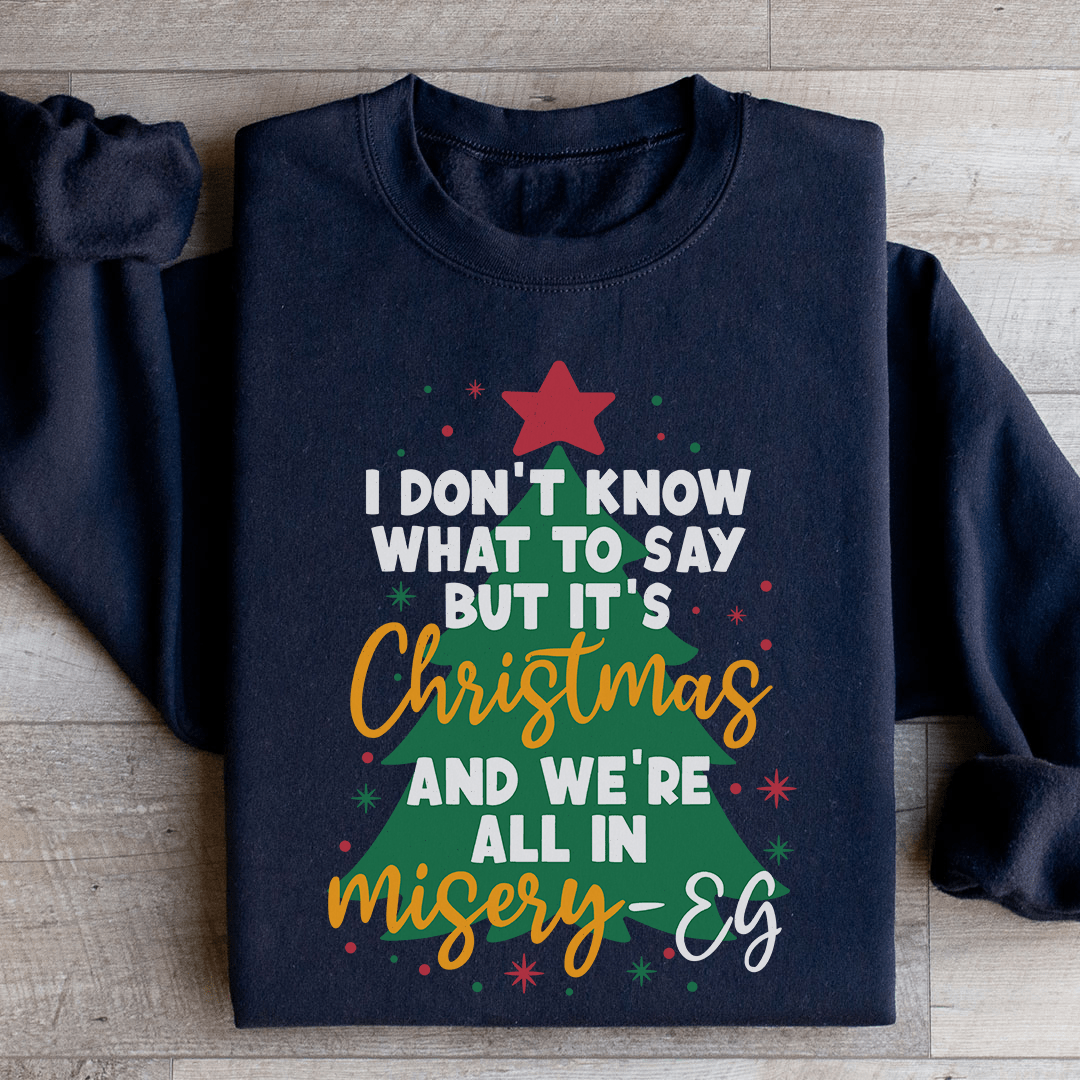 Cozy 'It's Christmas And We're All In Misery' sweats featuring unique designs by top artists, made from a warm cotton/poly fleece blend.