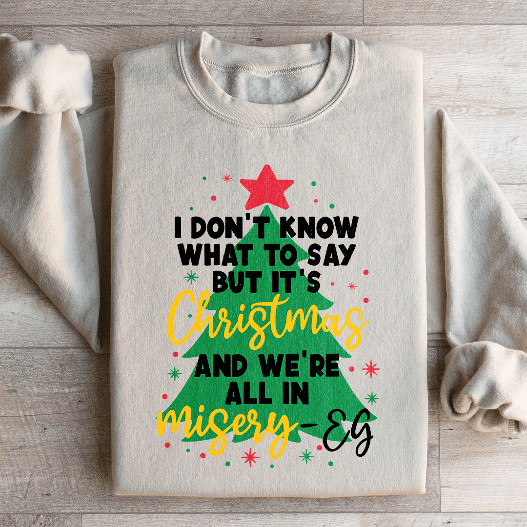 Cozy 'It's Christmas And We're All In Misery' sweats featuring unique designs by top artists, made from a warm cotton/poly fleece blend.
