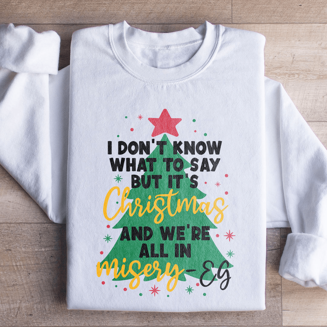 Cozy 'It's Christmas And We're All In Misery' sweats featuring unique designs by top artists, made from a warm cotton/poly fleece blend.