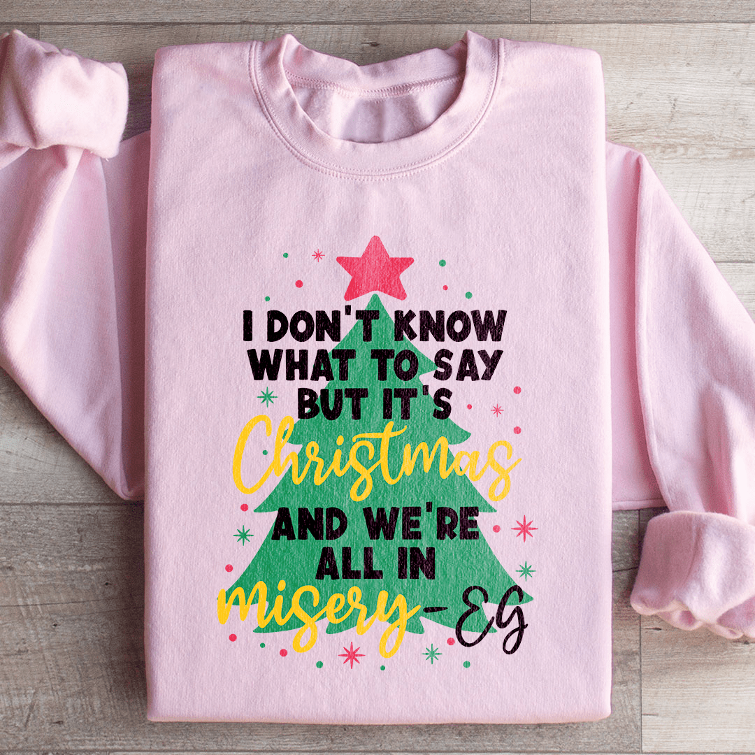 Cozy 'It's Christmas And We're All In Misery' sweats featuring unique designs by top artists, made from a warm cotton/poly fleece blend.